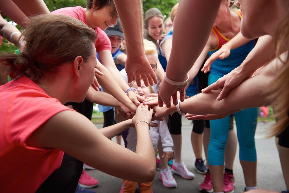 jogging people group, friends have fun,  hug and stack hands together after training-2.jpg