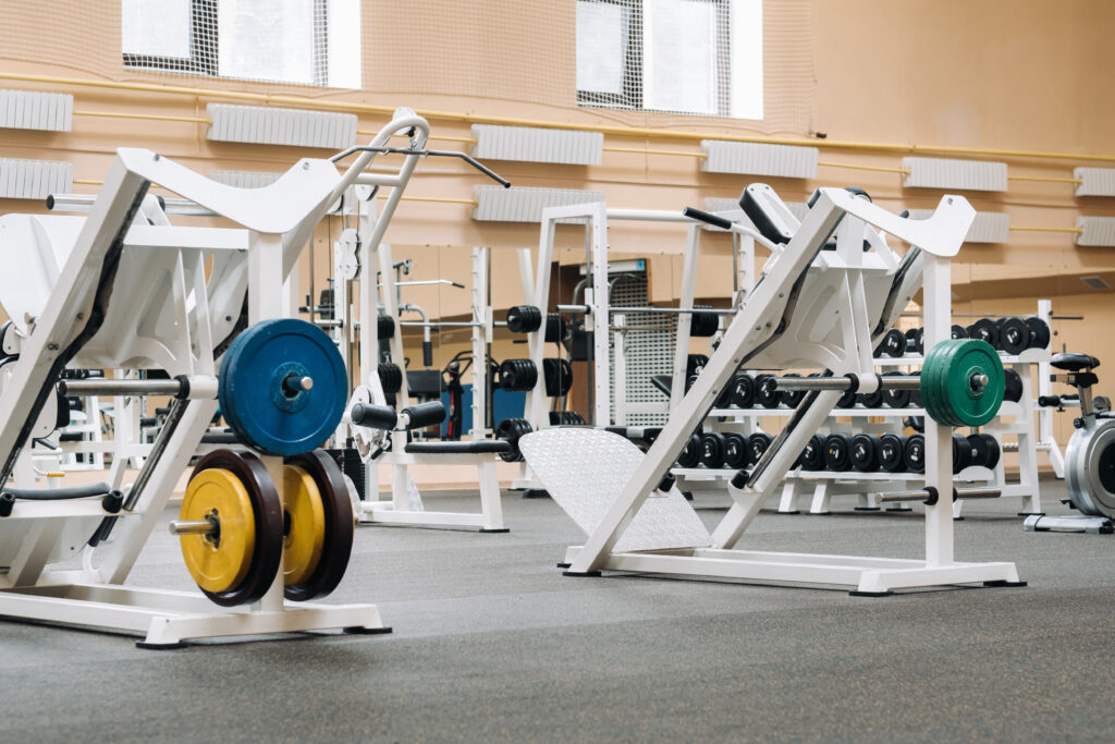 Weight-lifting equipment in a modern gym.