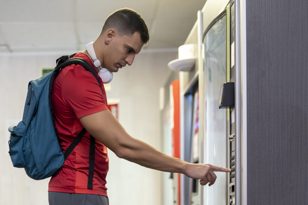 Gym member using the vending machine