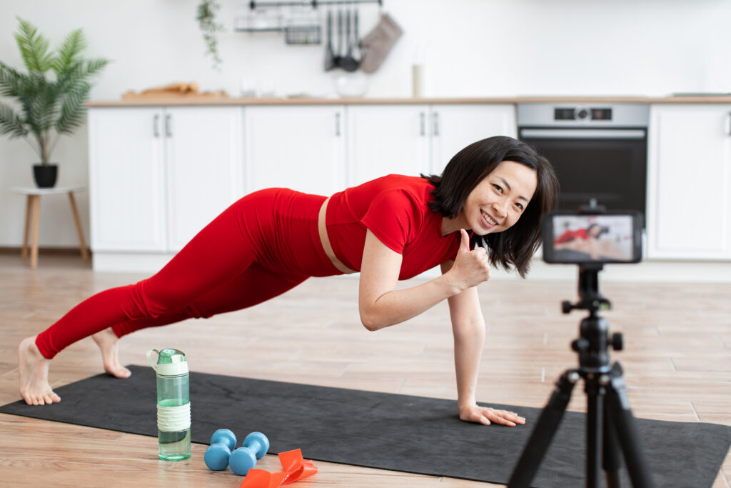 Fitness influencer shooting content while working out