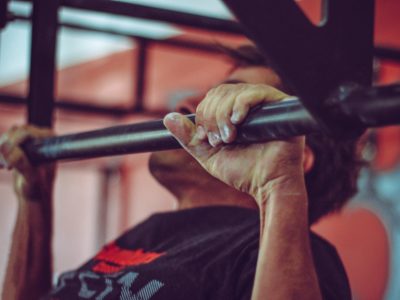 close up of a man doing pull-ups